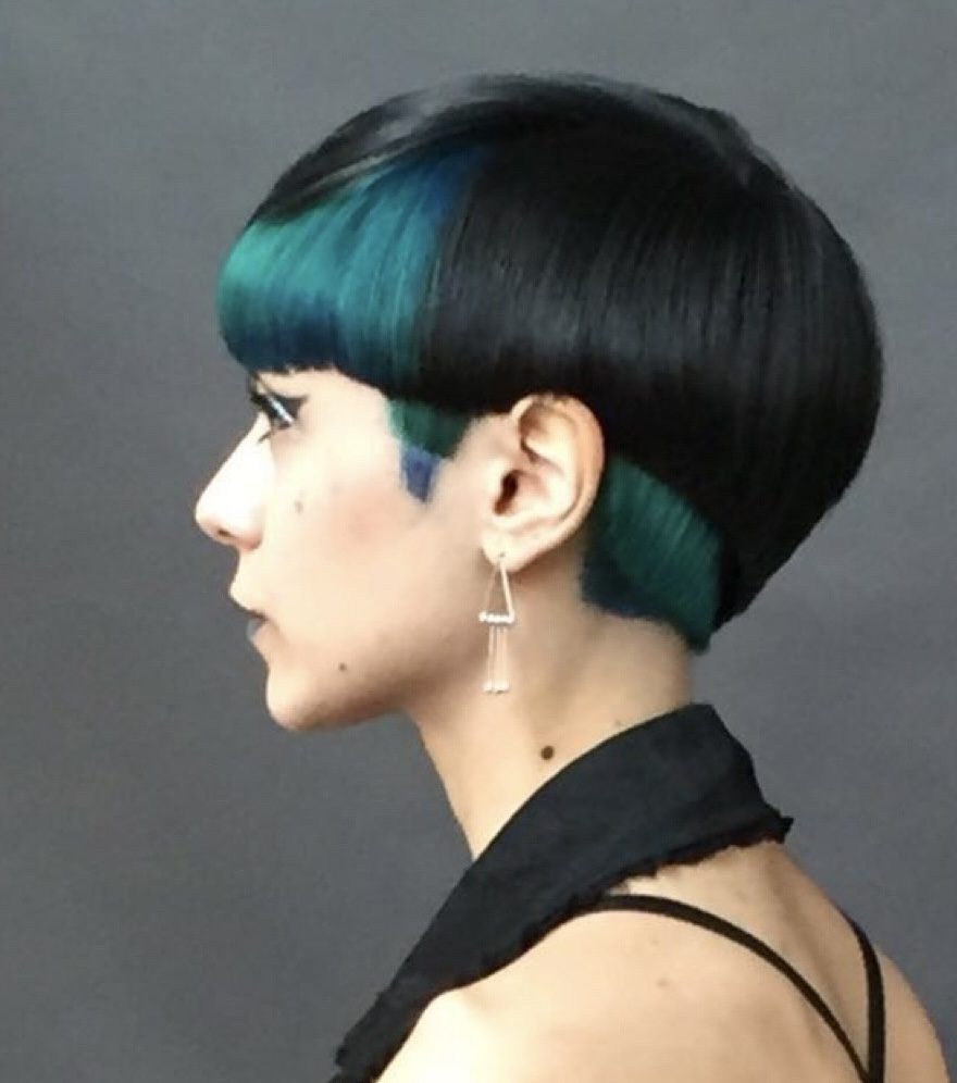 Short asymmetric bob with teal colour, seen in profile